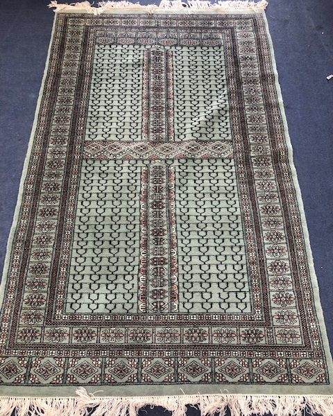 A North West Persian green ground rug 203 x 126cm